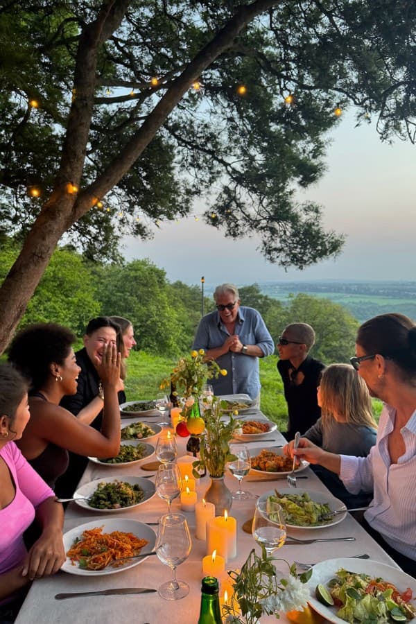 Guests gathered around a candlelit table