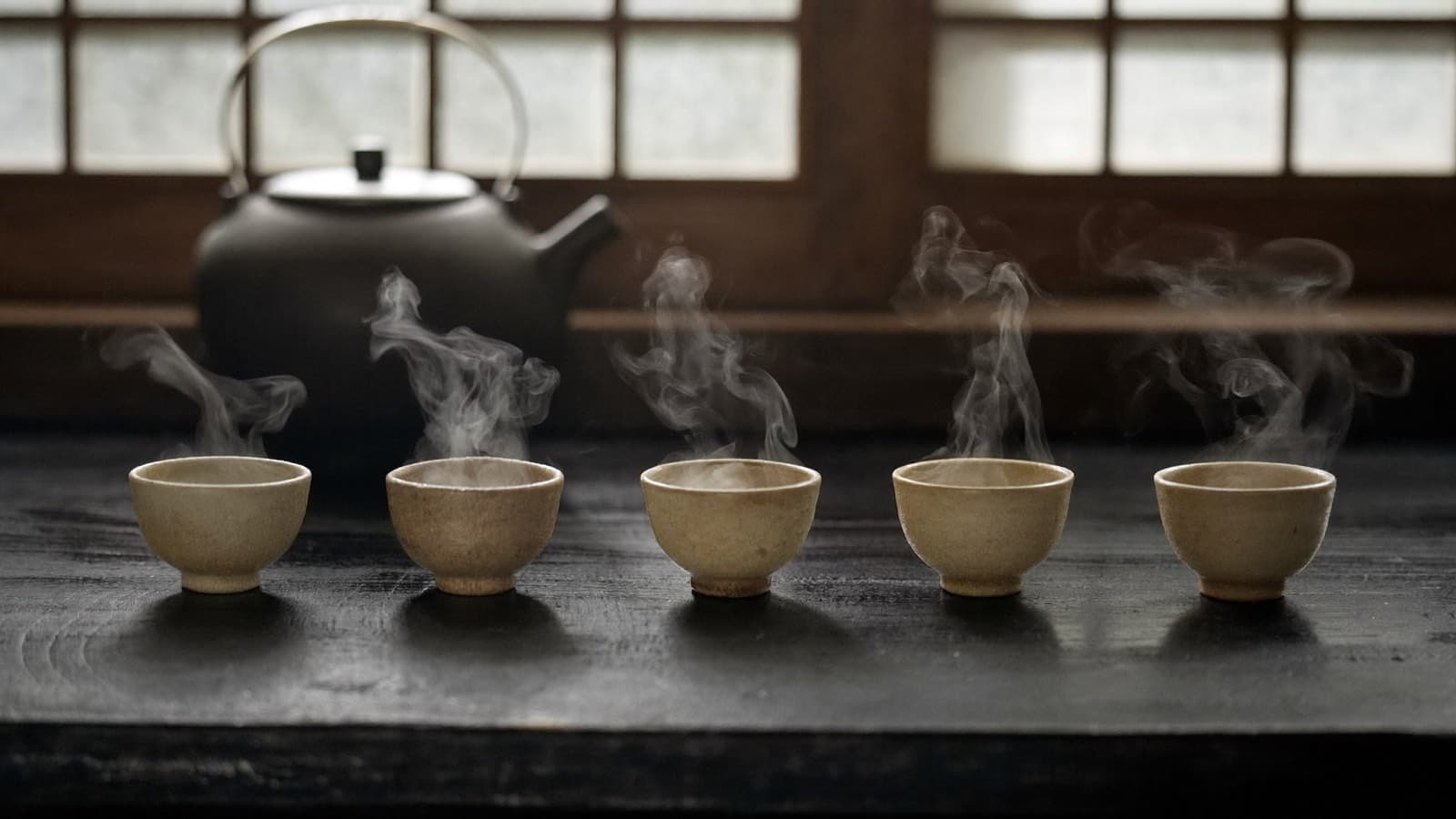 Tea service laid along a shared table